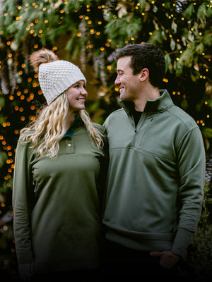 Couple wearing Woolx in front of Holiday light background Mobile Image