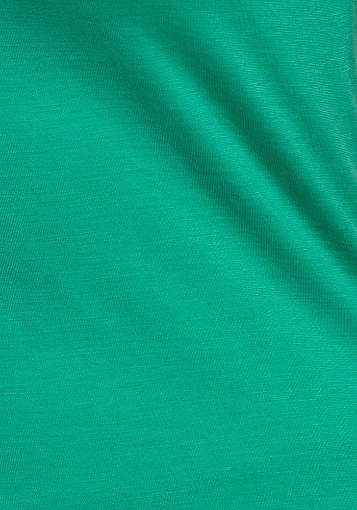 A close-up of the Woolx Summit Polo - Jungle, showcasing fine Merino wool texture and moisture management.