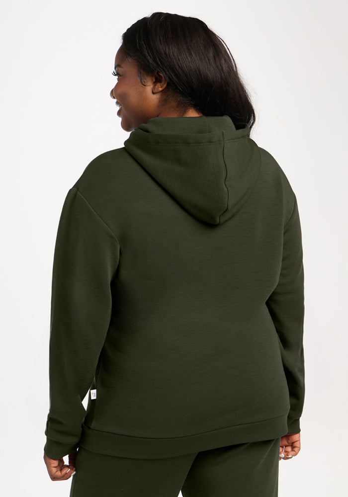 Person in a Woolx Avery Hoodie - Duffel Bag, matching pants, seen from behind against a plain background.