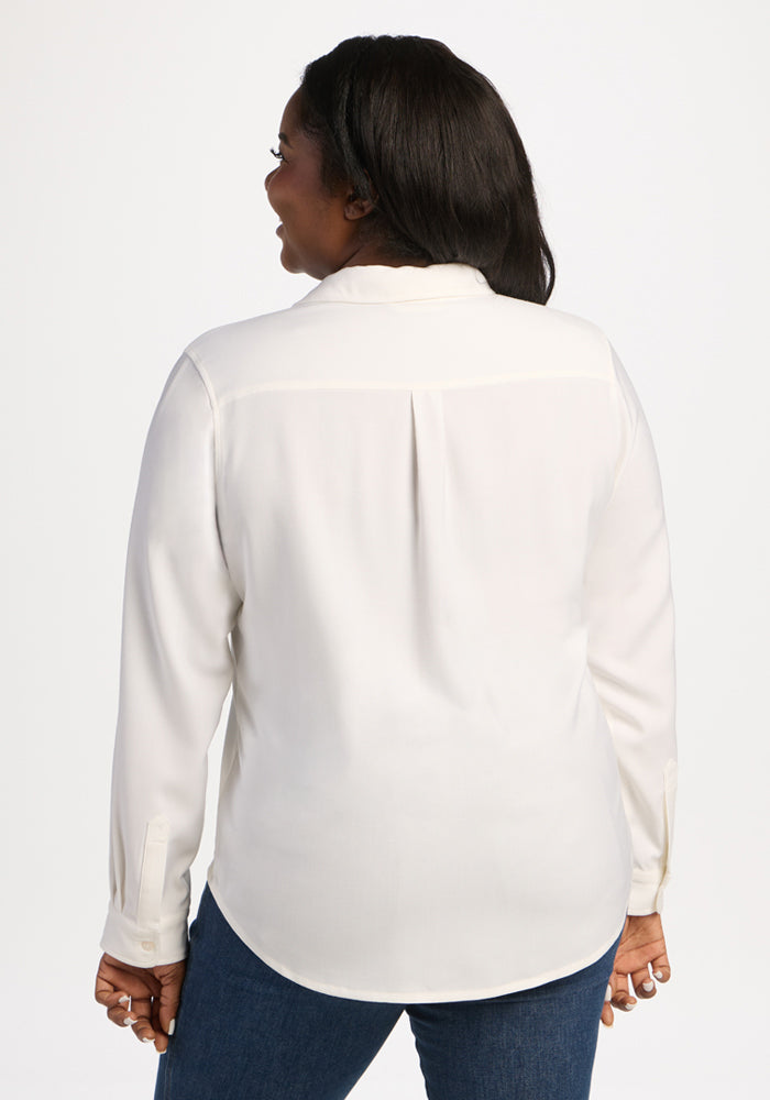 Woman in a Woolx Lorelai Button Up - Eggshell and blue jeans, shown from the back on a white background.