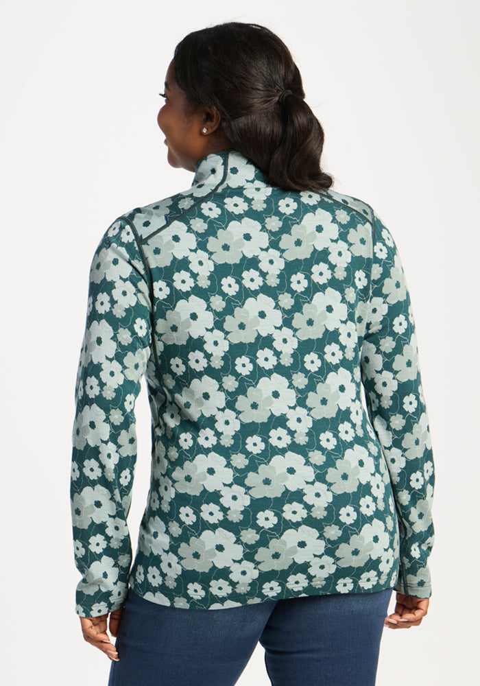 Woman in Emi 1/4 Zip - Coastal Wildflower by Woolx, a Merino layer for warmth and moisture wicking comfort.