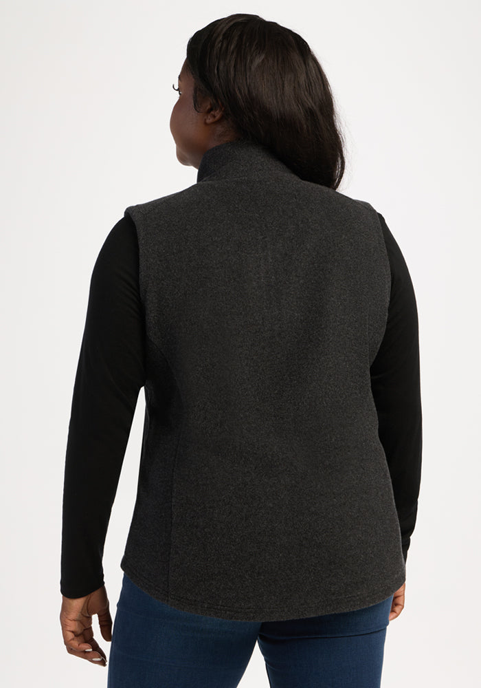 Model wears Woolx Haley Vest - Carbon Black over a black shirt, shown from the back on a plain background.