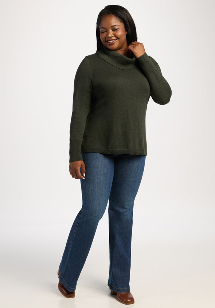 Woman in the Woolx Josie Cowl Neck Sweater - Duffel Bag smiles while posing against a plain white background.
