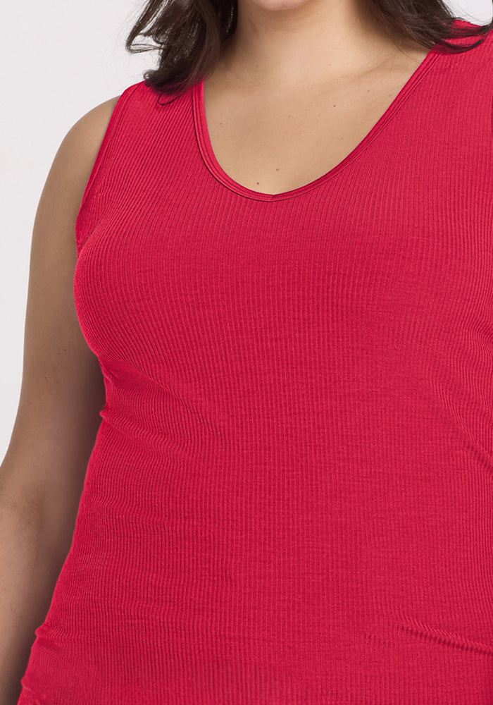 Someone wears the Woolx Vivi Ribbed Tank in Berry Ice Pop, shown from shoulders to waist.