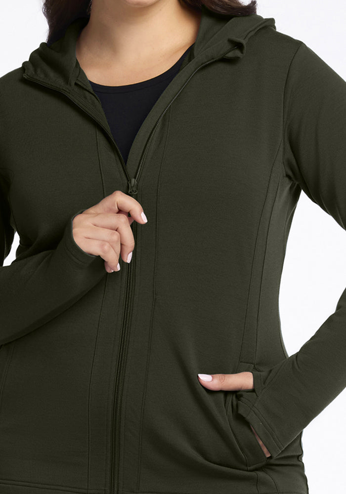 Woman in Woolx Zoey Zip Up Hoodie - Duffel Bag, one hand by zipper, other in pocket, on white background.