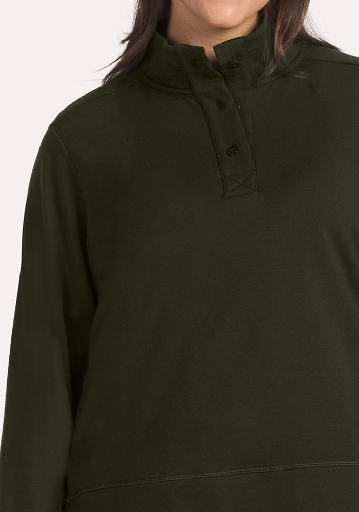 Model in the Woolx Annie 3 Button Pullover in Duffel Bag, high collar visible, shown shoulders to mid-chest.