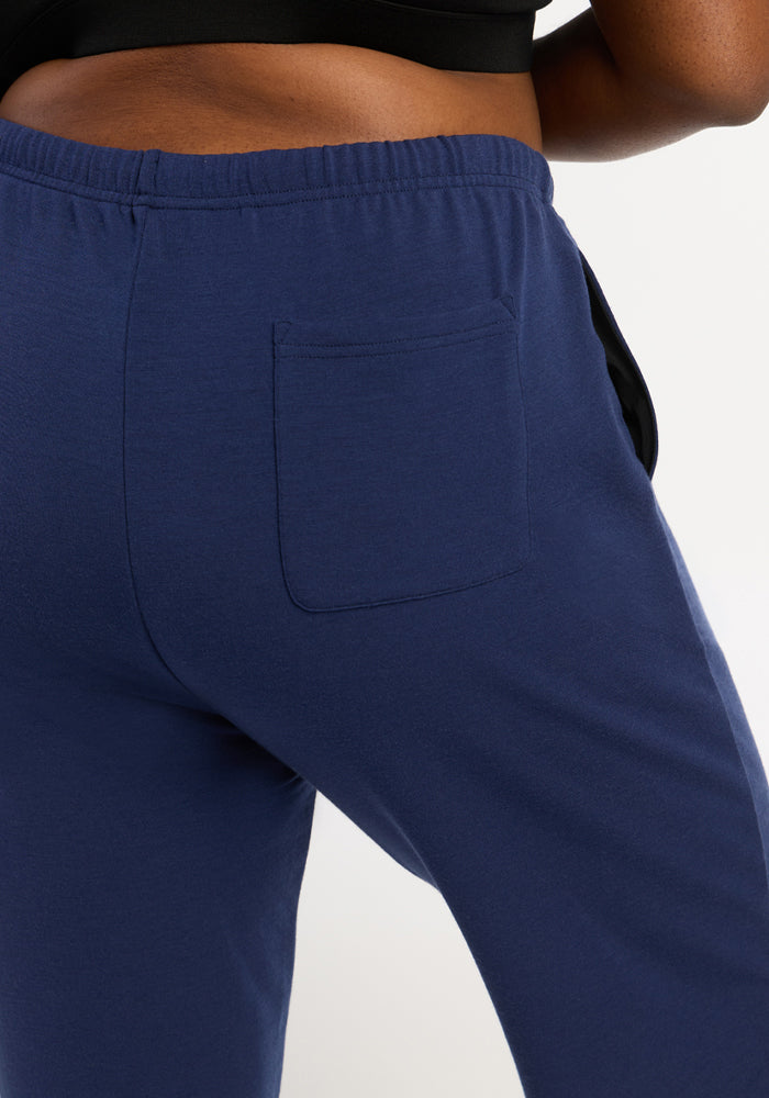 Close-up of Woolx Juliette Joggers in Ocean Cavern, highlighting the small back pocket from waist to mid-thigh.