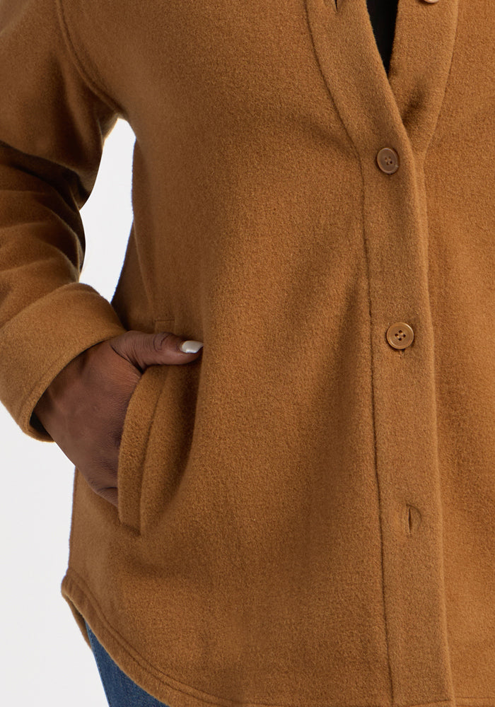 Model in Woolx Jovie Shacket - Saddleback, hand in pocket; cozy Merino wool layering from shoulder to hip.