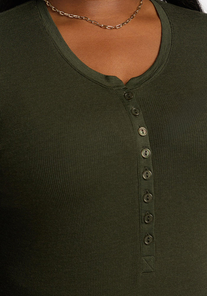 Close-up of Woolx Reese Ribbed Henley - Duffel Bag in dark green, styled with a gold chain necklace.