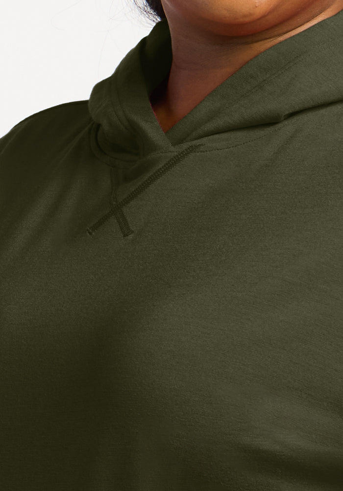 Close-up of a person in the Woolx Lizzy Hoodie - Everleaf, showcasing the buttery soft neckline and shoulders.