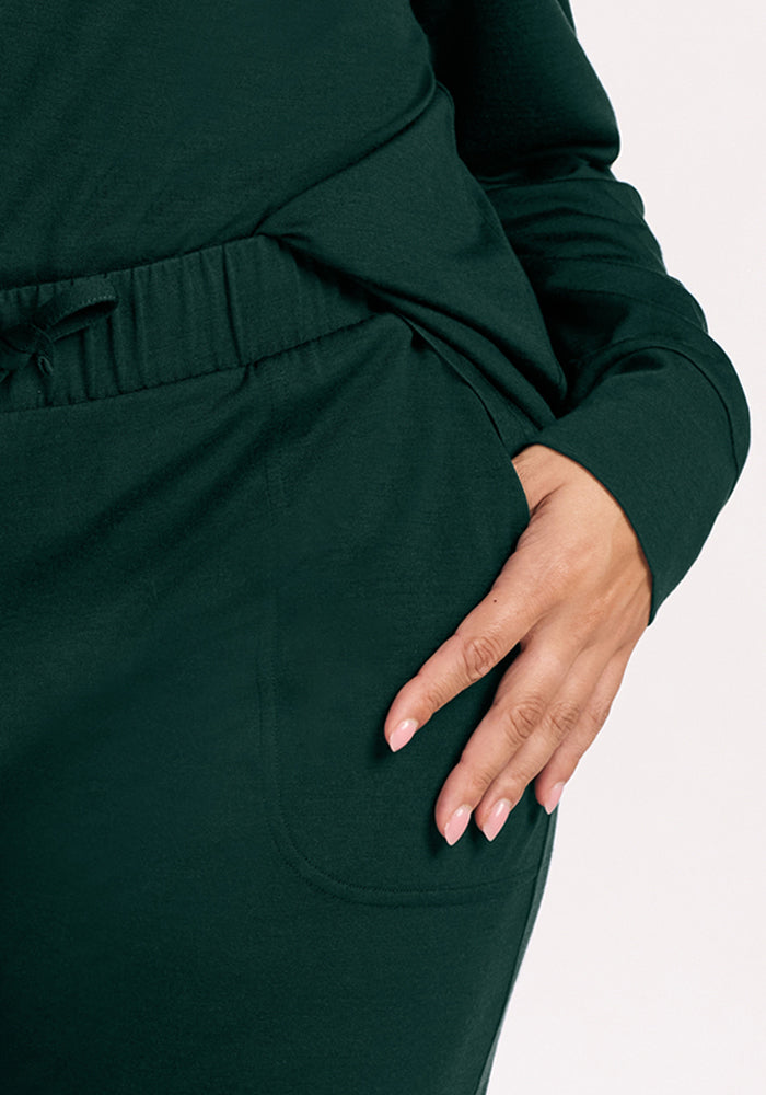 Deep Pine Mary Kate Lounge Pants in moisture-wicking Merino wool with an elastic drawstring waist and side pockets.