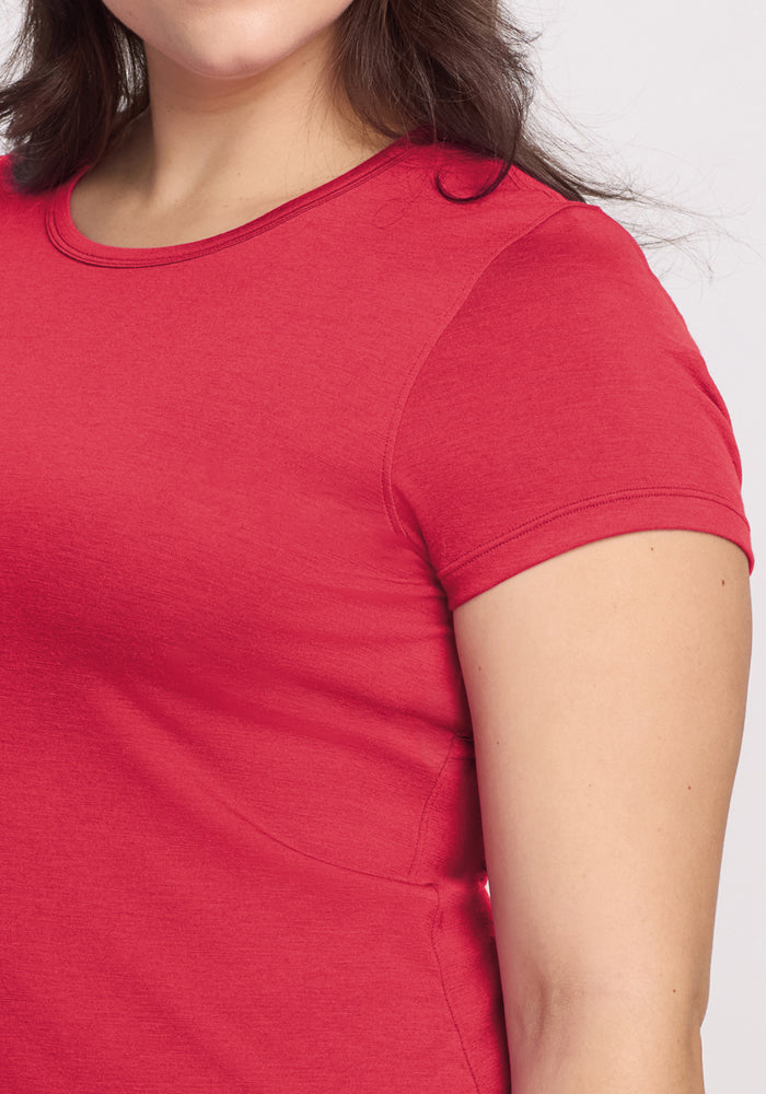 A woman wears the Woolx Addie Crew Neck in Berry Ice Pop, a lightweight fitted Merino wool T-shirt.