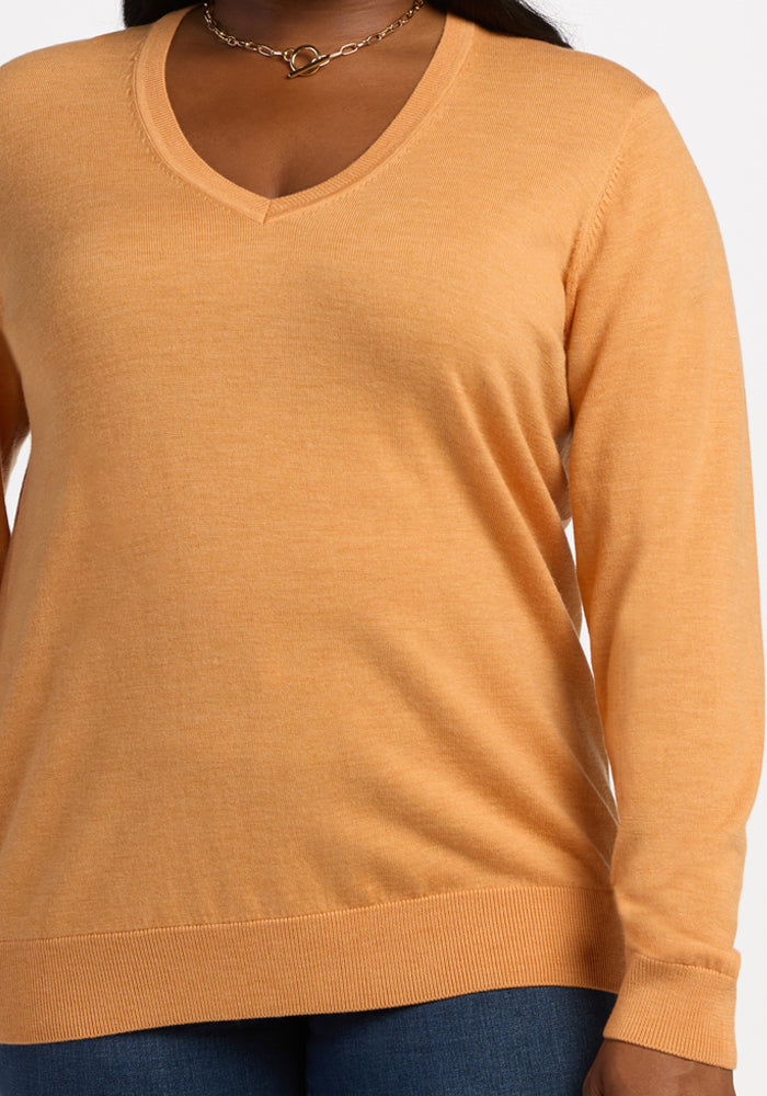 Model wears the Woolx Francesca Sweater in Butterscotch with a gold chain necklace, shown from shoulders to hips.
