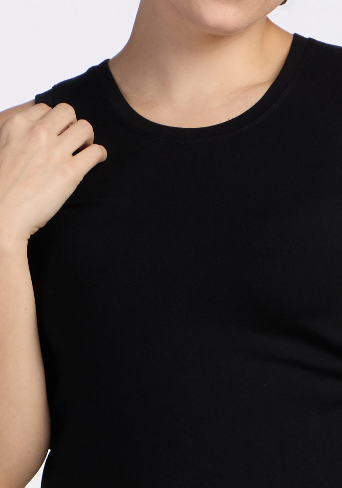 A close-up shows a person wearing the sleeveless black Woolx Ava Tank Top, with one hand near their shoulder and their face partially out of frame.
