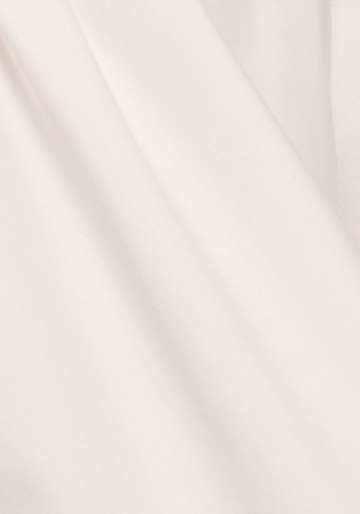 Woolx Nash Button Up in Eggshell: a light, cream Merino wool shirt with soft drape and moisture-wicking comfort.