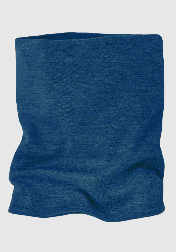 The Woolx Neck Gaiter - Majolica Blue is shown flat on a light background, highlighting its tubular shape, soft Merino wool texture, and subtle wrinkles—ideal for keeping your neck warm and cozy.