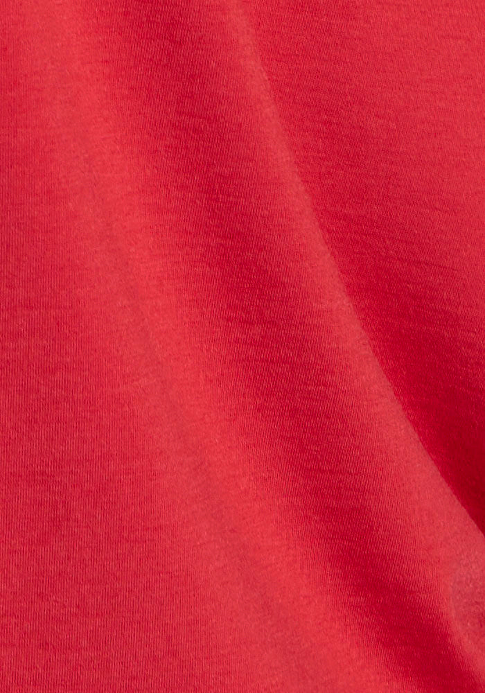 Close-up of Woolx Margot Bodysuit - Maraschino Cherry, highlighting buttery-soft fabric, texture, and weave detail.