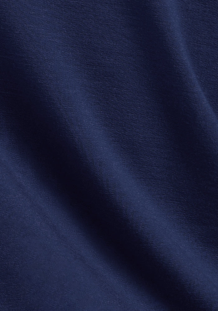 Close-up of Woolx Piper Pocket Petite - Ocean Cavern leggings in dark blue merino wool, soft and slightly textured.