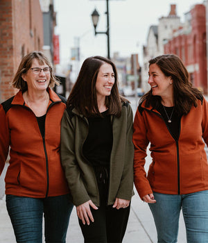 Three models wearing Peri jackets in copper and olive mobile size