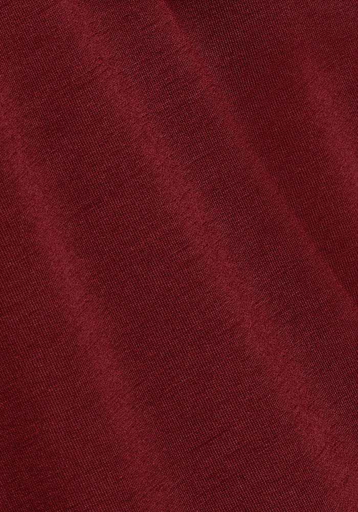 Close-up of Woolx Jackson Henley - Pinot Noir fabric with soft merino wool texture and subtle diagonal folds.