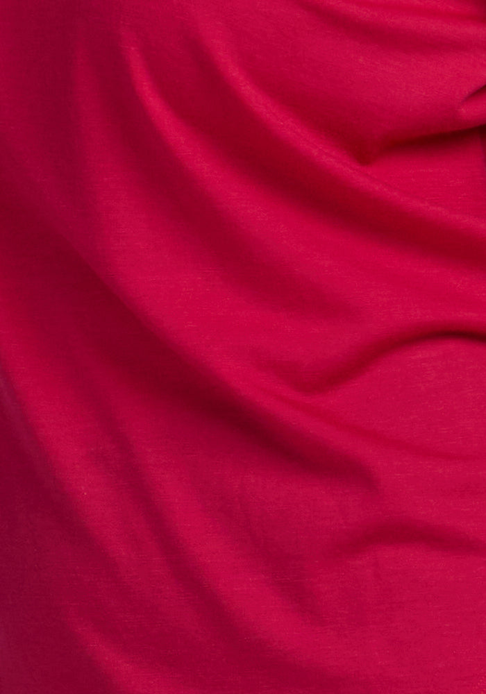 Close-up of the Jenny 3/4 Sleeve Crew Neck in Poppy Spark by Woolx, featuring bright red lightweight Merino fabric with soft folds and gentle creases for a textured, slightly wavy look.