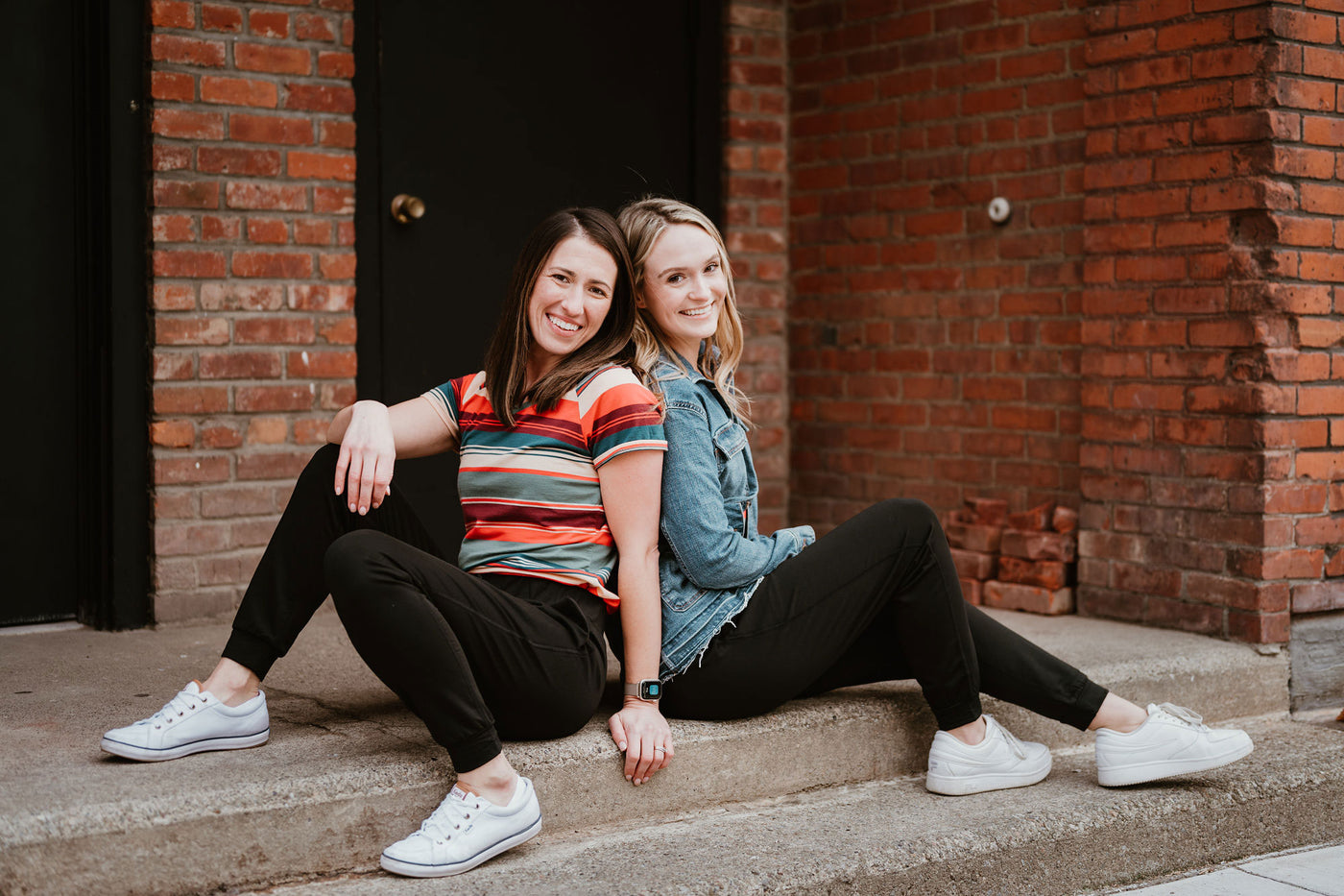 2 girls wearing Woolx sitting on steps