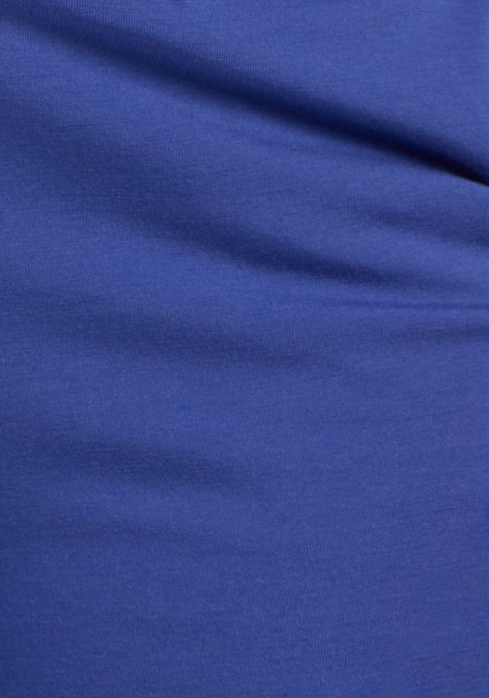 Close-up of Woolx’s Lizzy Hoodie in Royal Blue, highlighting its buttery soft, smooth texture and gentle, luxe folds.