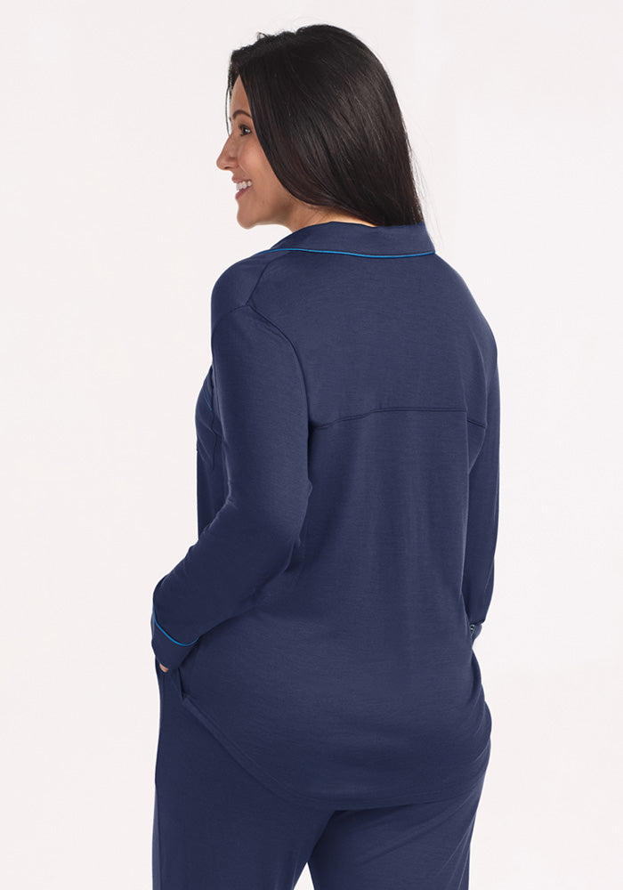 View from behind of a person wearing navy blue Harper FeatherTouch® Pajama Set - Deep Dive with bright blue trim.
