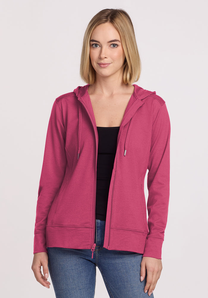 Blonde woman wears the Woolx Ryann Hoodie in Mulberry, black top, and jeans against a white background. | Georgia is 5’10”, wearing a size XS