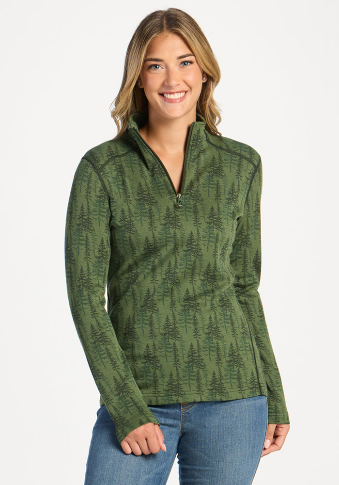 Woman in Woolx Emi 1/4 Zip - Forest Friends smiles, enjoying its temperature-regulating Merino wool comfort. 