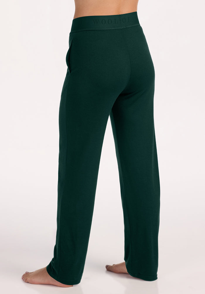 Back view of deep pine Maya Lounge Pants with an elastic waistband in moisture-wicking fabric.
