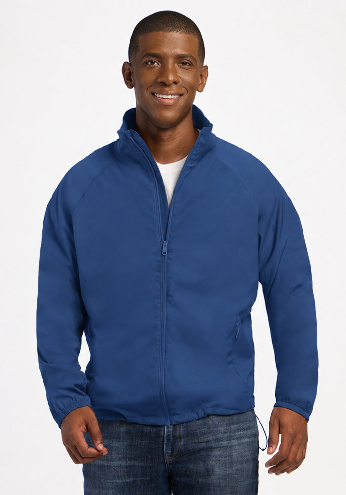 A man wearing a Woolx Dominator Windbreaker - Vintage Indigo over a white t-shirt. 