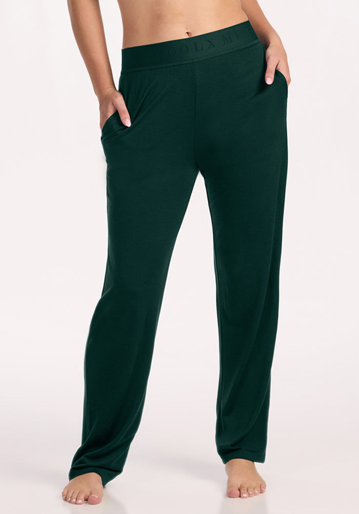 Deep Pine Woolx Maya Lounge Pants featuring moisture-wicking fabric, a wide elastic waistband, and side pockets. | Ariana is 5'11", wearing a size S