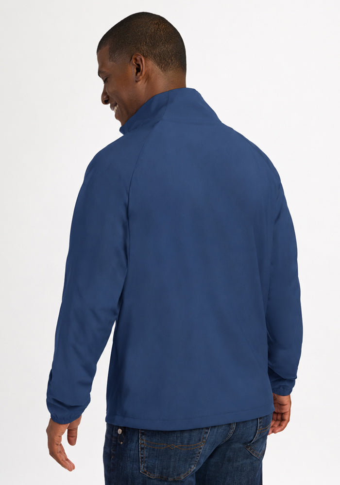 A man seen from behind wearing a blue Woolx Dominator Windbreaker - Vintage Indigo.