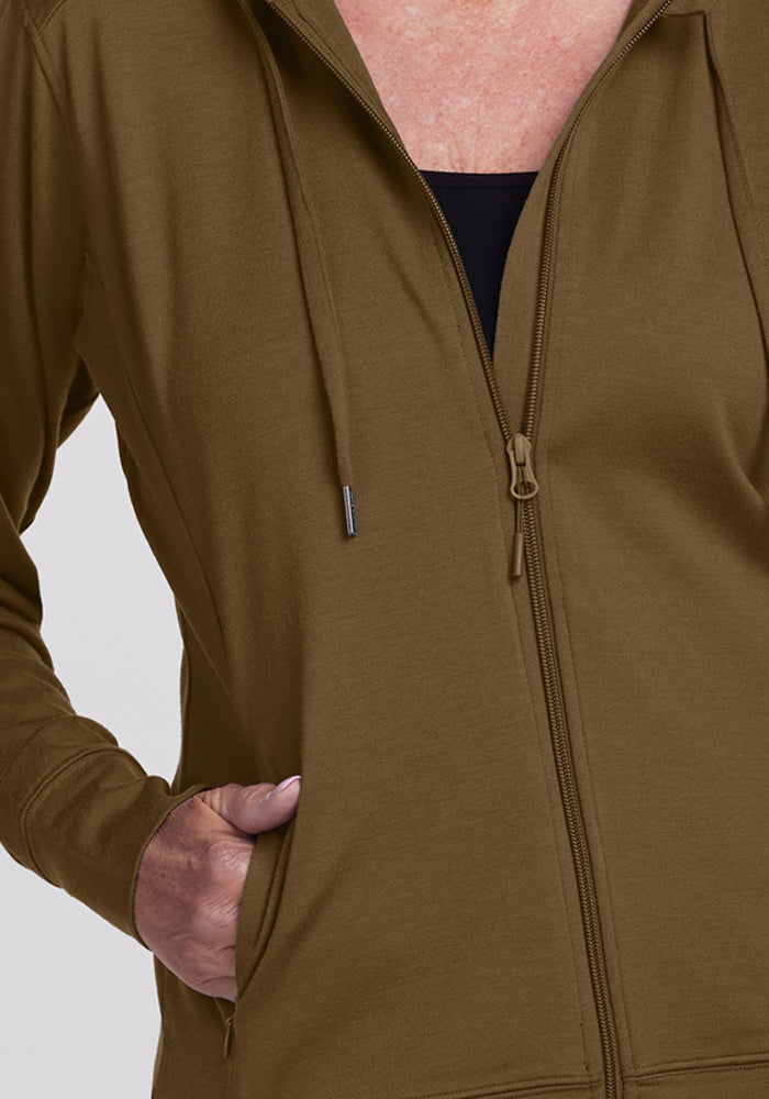 A person wears the Woolx Ryann Hoodie in Olive Leaf, one hand in pocket, shown from shoulders to waist.