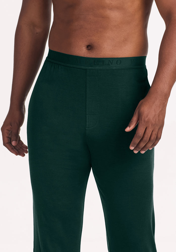 Dark green Woolx Arlo Lounge Pants - Deep Pine in merino wool with an elastic waistband featuring the word “MERINO.”
