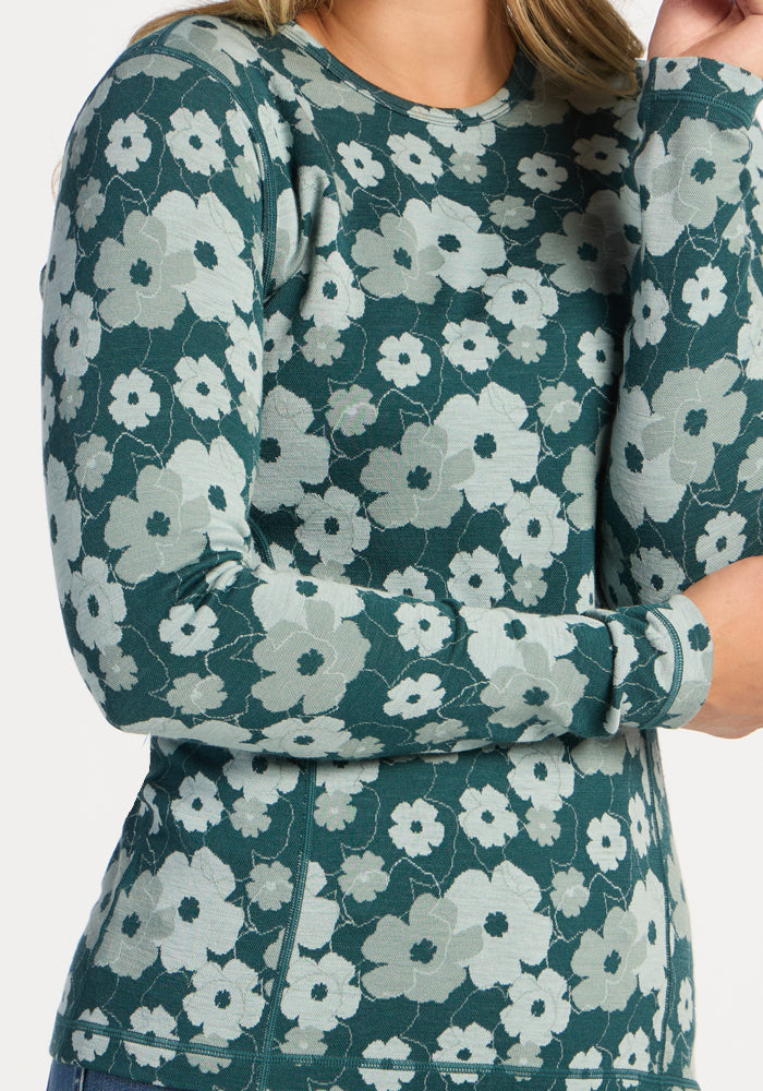 Model in Woolx Maddie Baselayer Top - Coastal Wildflower; only upper body and arms shown.