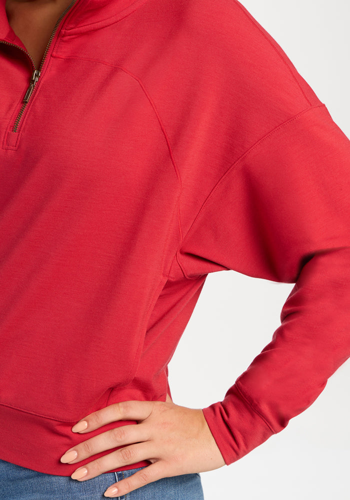 Woolx Tori 1/4 Zip in Maraschino Cherry, a lightweight merino pullover with a quarter-zip, drop shoulders, and metal zipper.