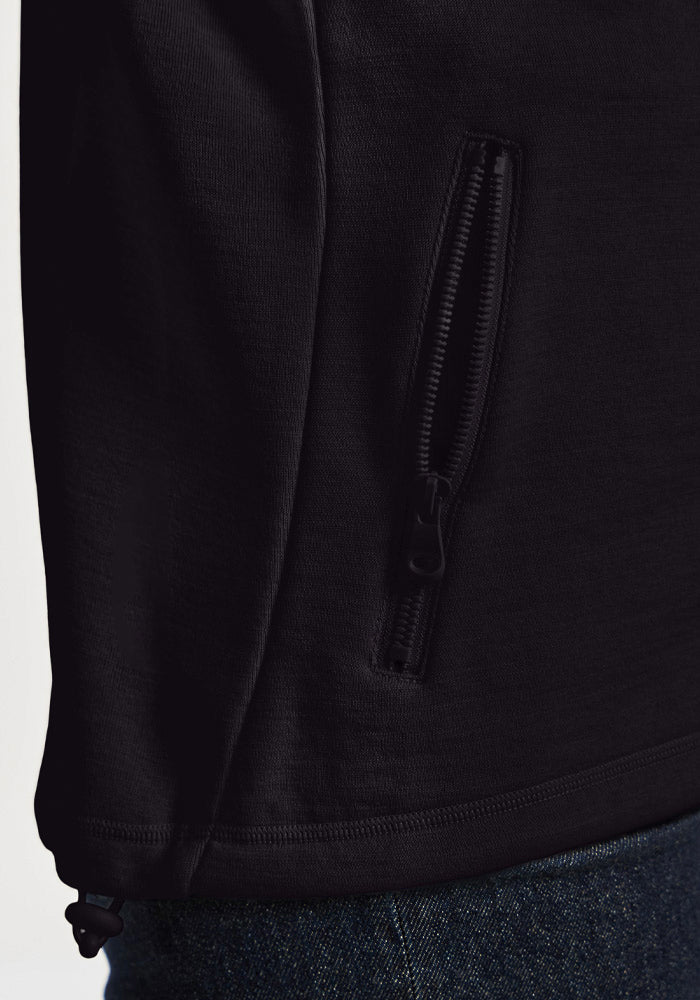 Close-up of a black Woolx Teddy Sweatshirt side pocket with a vertical zipper and adjustable drawstring hem.