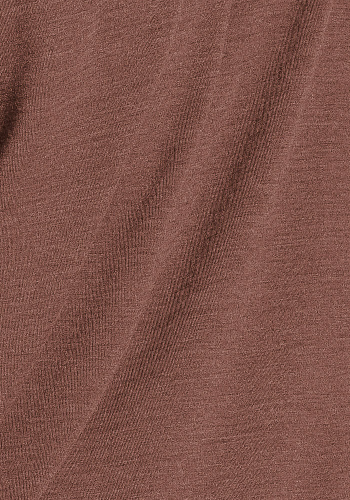 Close-up of Woolx Sadie Baselayer Top in Sable Heather, showing fine knit texture and subtle shadow detailing.