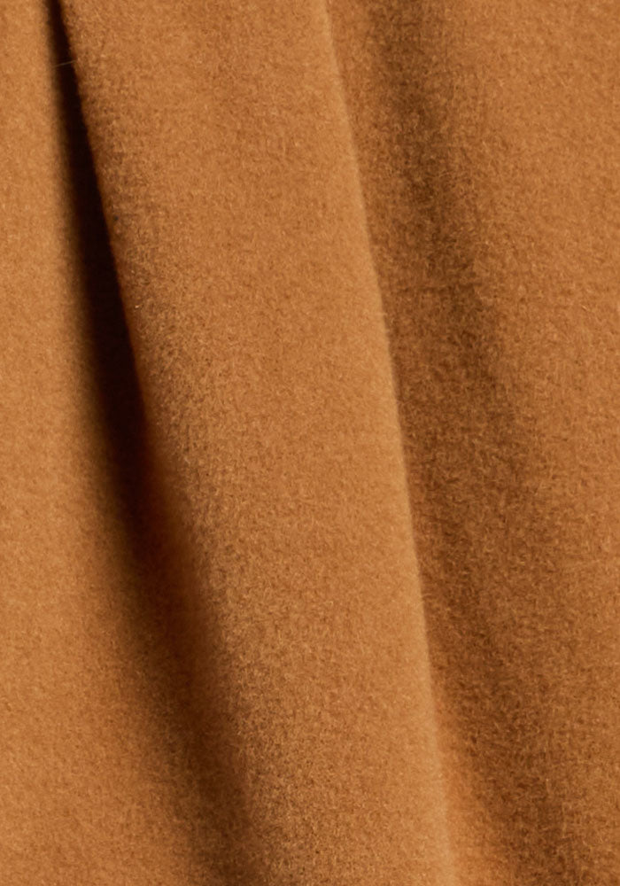 Close-up of Woolx Jovie Shacket - Saddleback’s soft, textured brown Merino wool fabric with a gentle vertical fold.