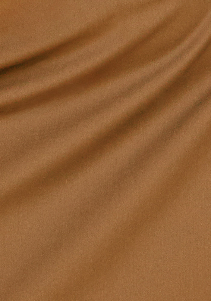 Close-up of Woolx Nicole Ankle Pants in Saddleback, showing soft merino wool folds and flowing texture.
