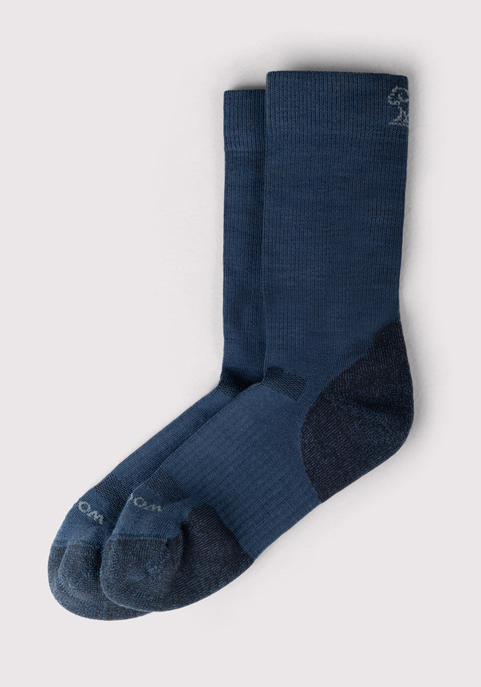The Woolx Womens Harbor Crew Sock in Majolica Blue features moisture-wicking fabric, reinforced heels and toes, and a thick, breathable design for comfort in colder weather.