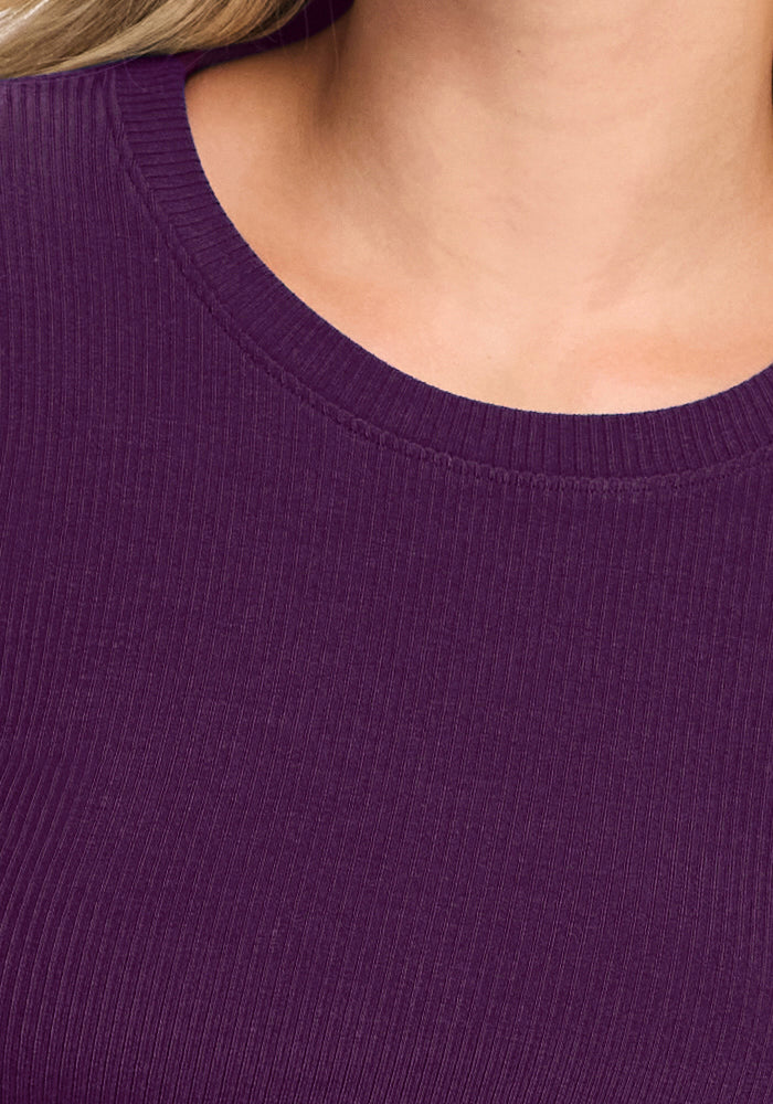 Close-up of a person wearing the Woolx Hadley Ribbed Crew in Majestic Purple, highlighting the neckline, shoulder, and upper chest. The ribbed Merino wool fabric’s breathable texture and moisture-wicking quality are clearly visible.