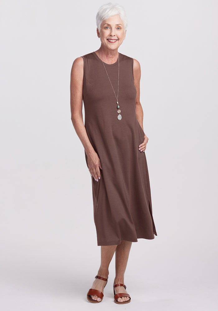 Smiling older woman in the Woolx Cassie Dress - Peppercorn looks effortlessly stylish and comfortable. 