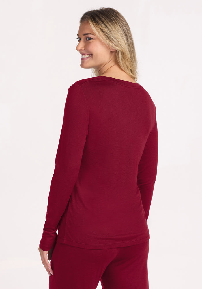 Woman seen from behind wearing a beet red Lily V Neck Lounge Top and matching bottoms.