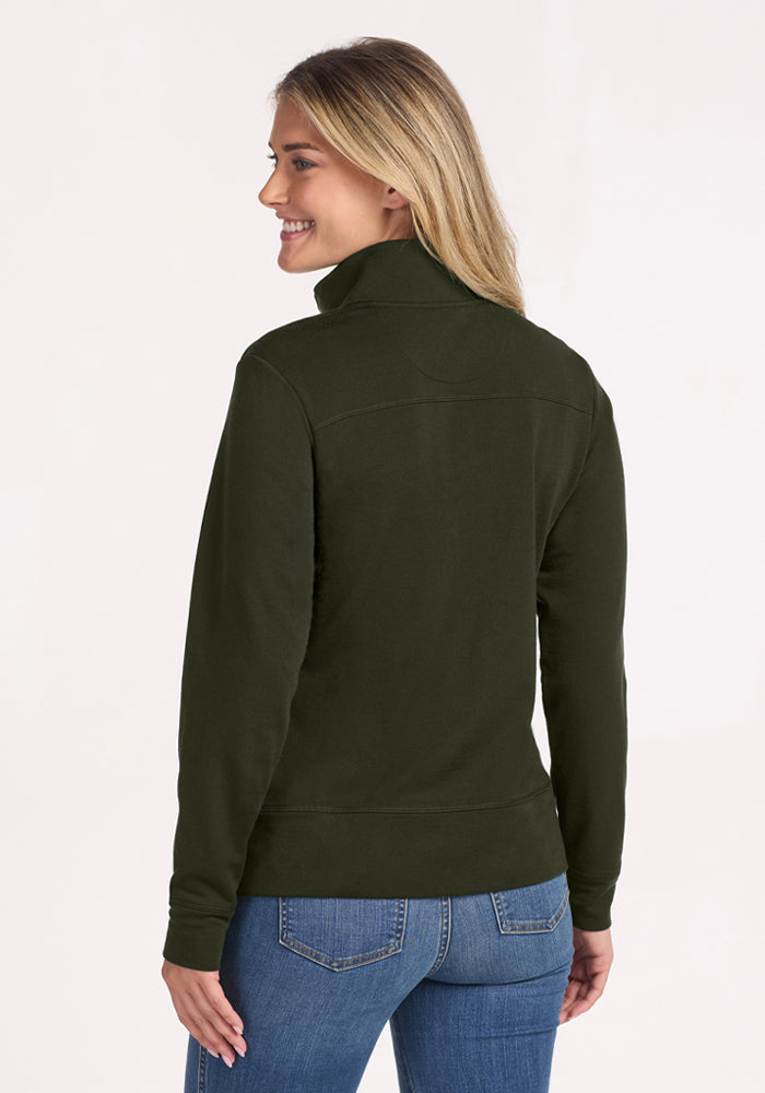 Woman smiling, facing away, wears Woolx Annie 3 Button Pullover - Duffel Bag with blue jeans against a light background.