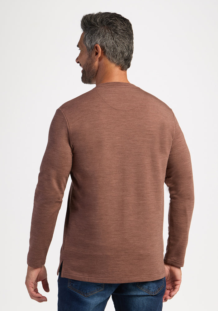 Man with short gray hair in a Woolx Jackson Henley - Sable Heather and blue jeans, back to camera.
