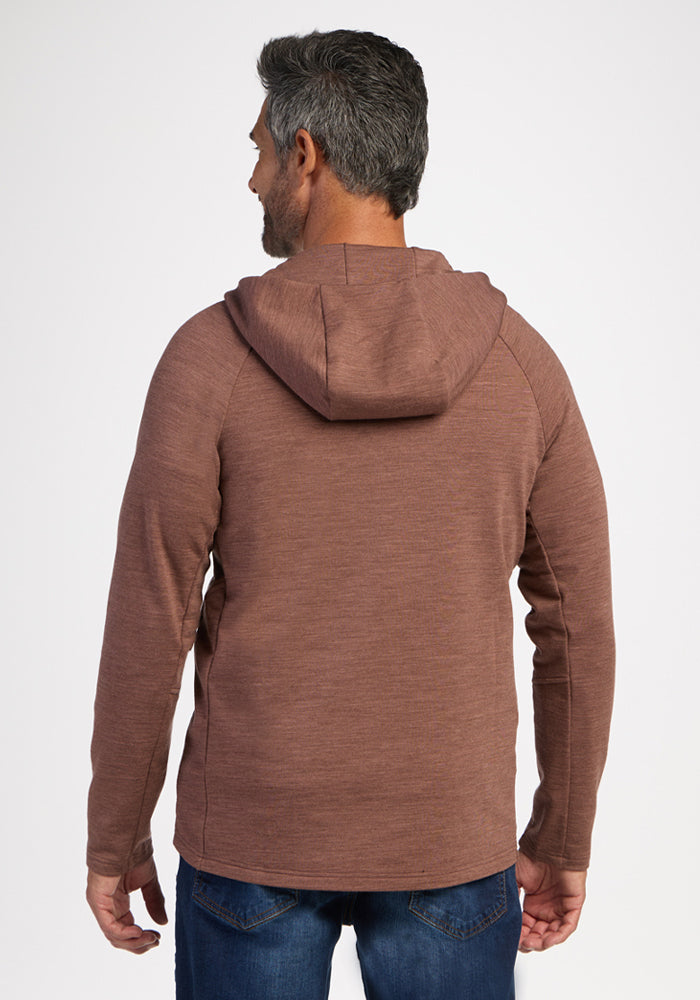 Man with short dark hair wears a Woolx Boulder Hoodie - Sable Heather and blue jeans, facing away from the camera.