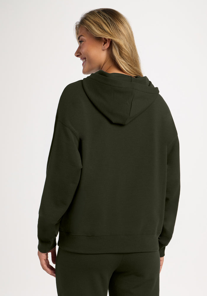 A person seen from behind wearing an olive green, moisture-wicking Genevieve Hoodie - Duffel Bag long-sleeve sweatshirt.